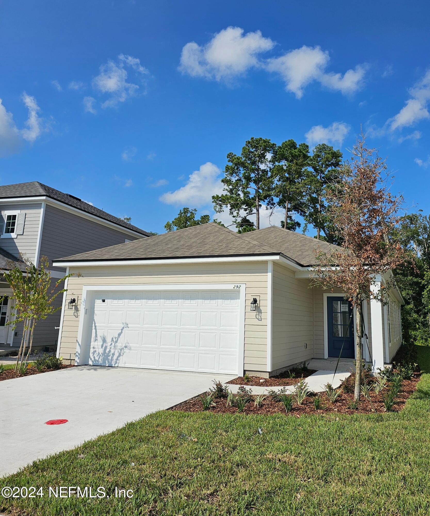 front view of a house with a yard