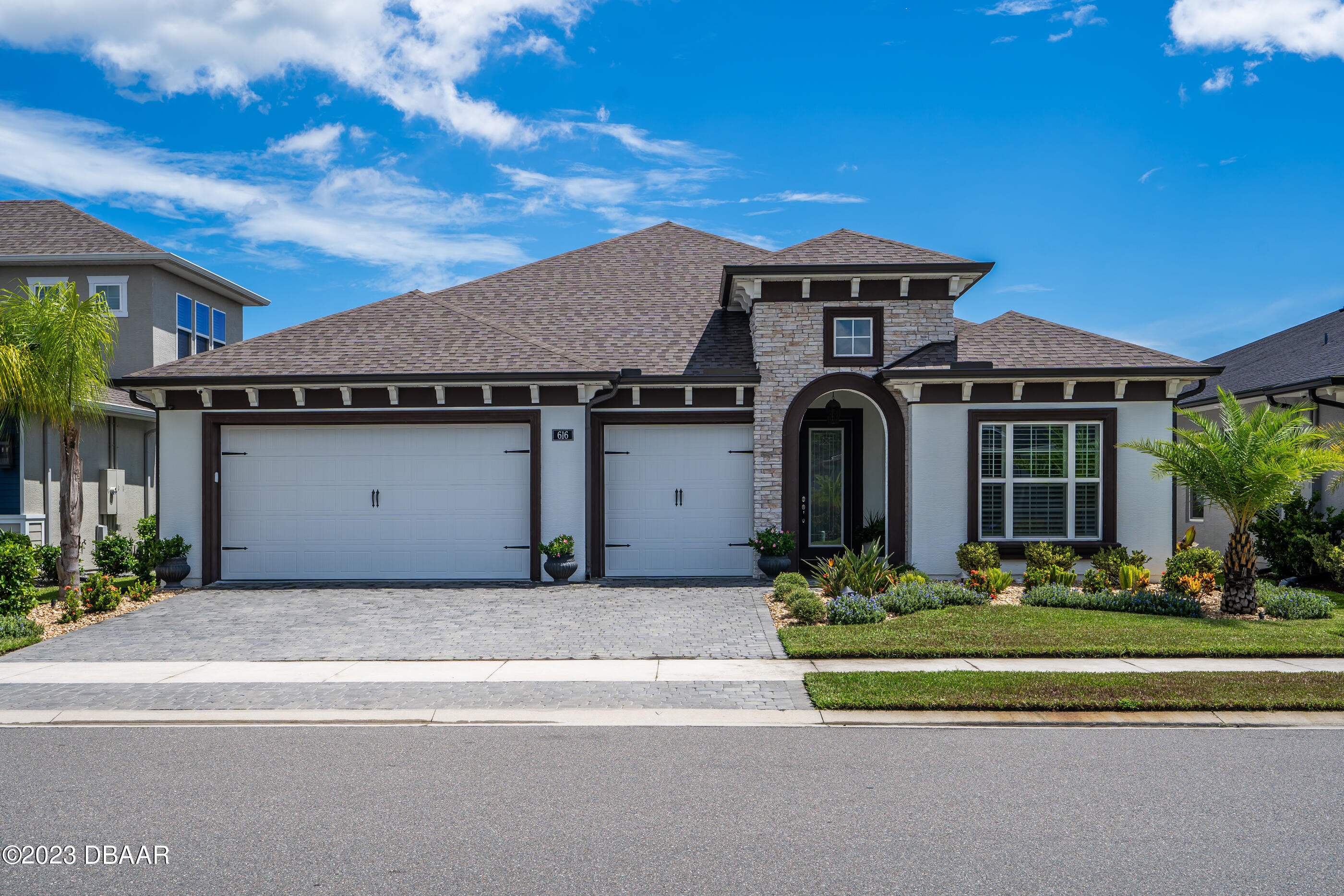 a front view of a house with a yard