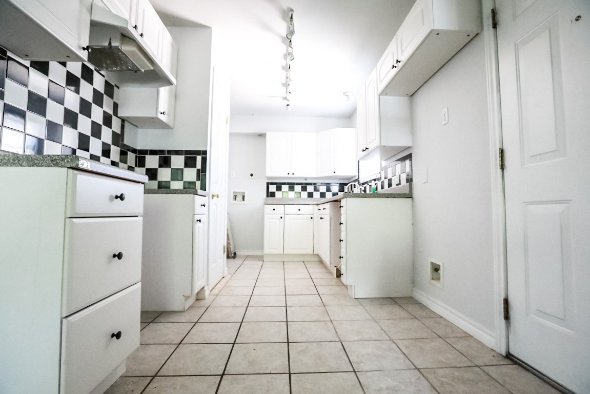 a kitchen with a refrigerator a sink and dishwasher