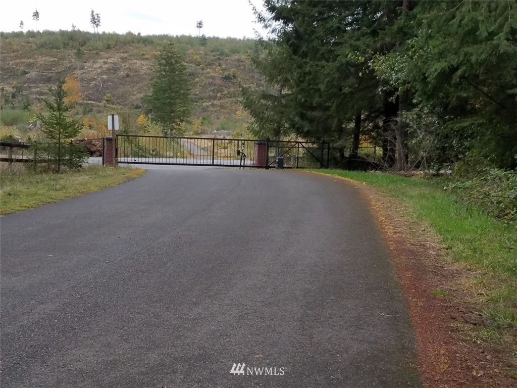 a view of a road with a building in the background