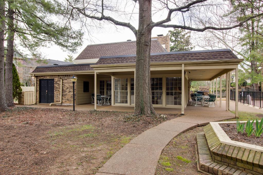 front view of a house with a garden