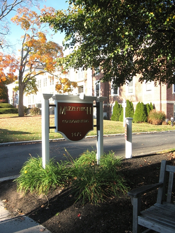 a view of a street with sitting area