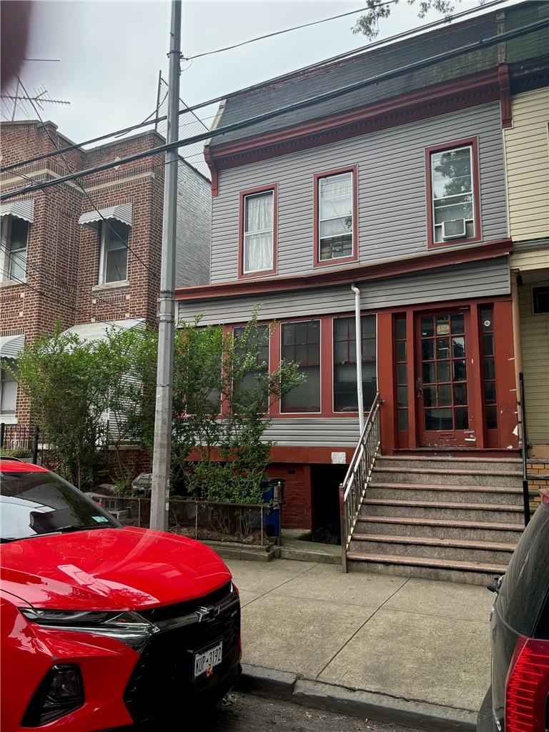 View of front of home with cooling unit