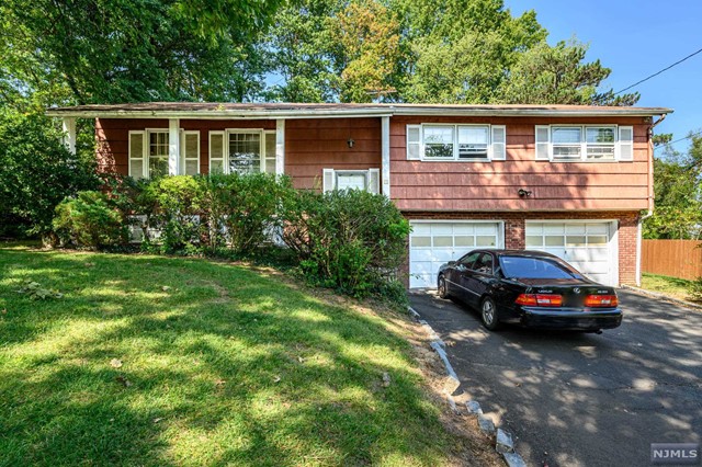 a car parked in front of a house