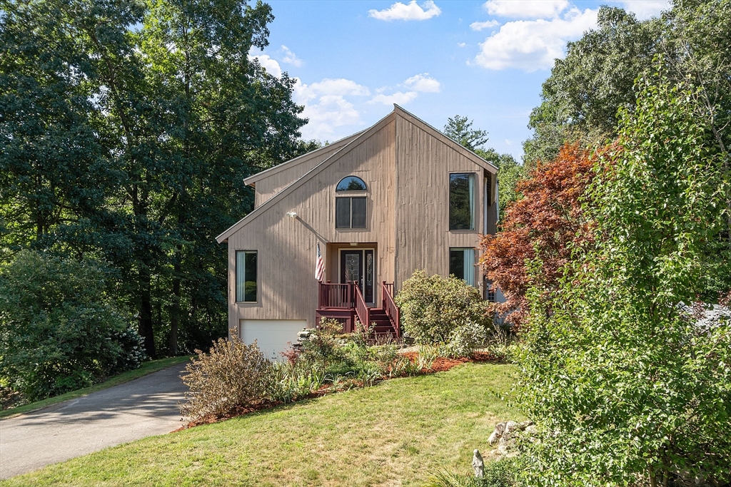 a house with trees in the background