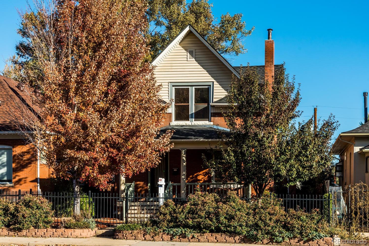 a view of house with outdoor space and trees