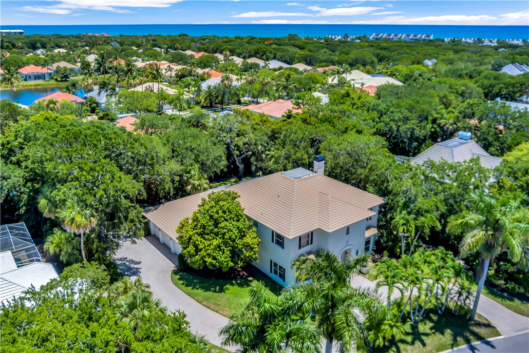 an aerial view of a house with yard