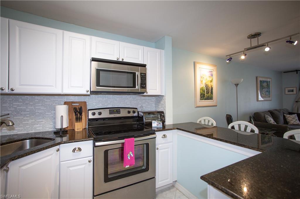 a kitchen with a stove and a microwave