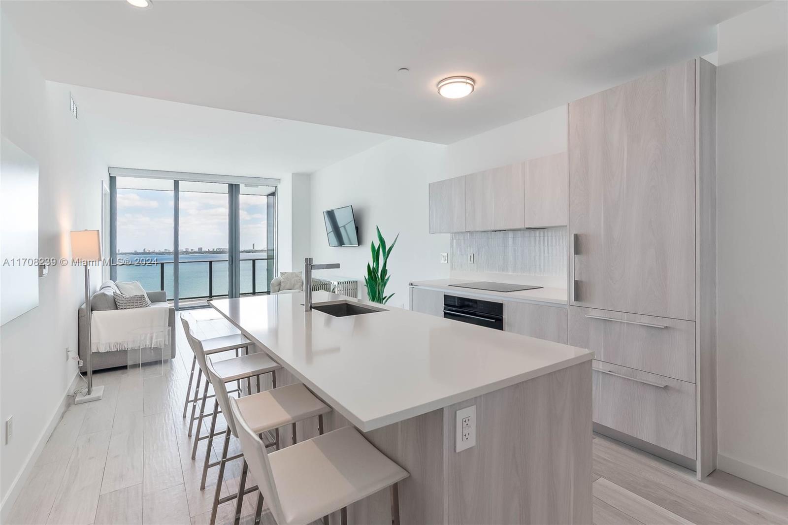 a kitchen with a table and chairs