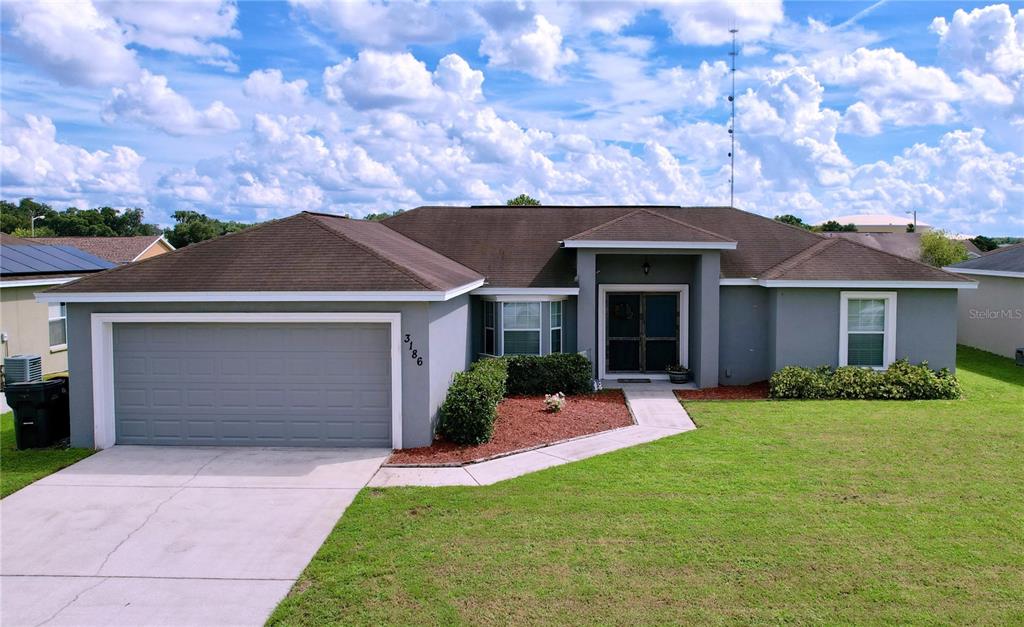 front view of a house with a yard