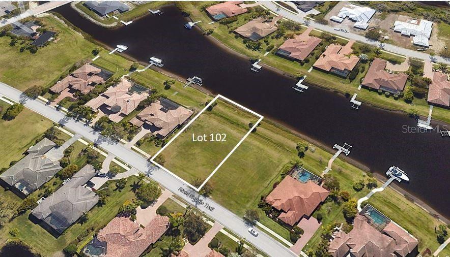 an aerial view of a house with a ocean view