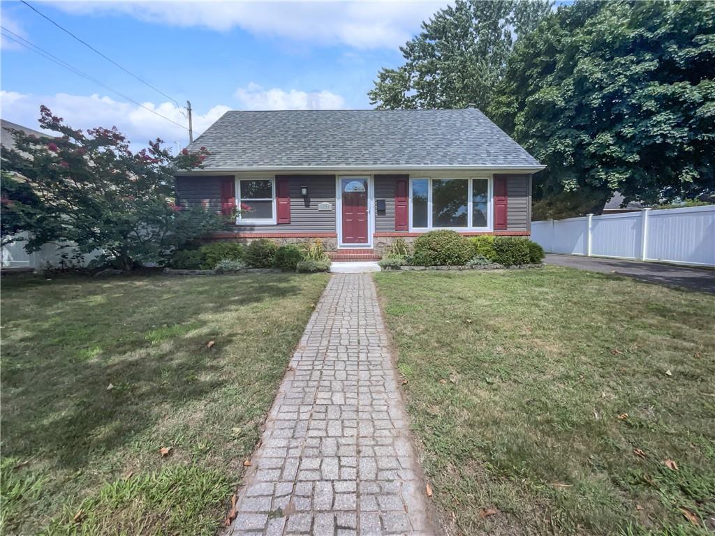 a front view of a house with yard