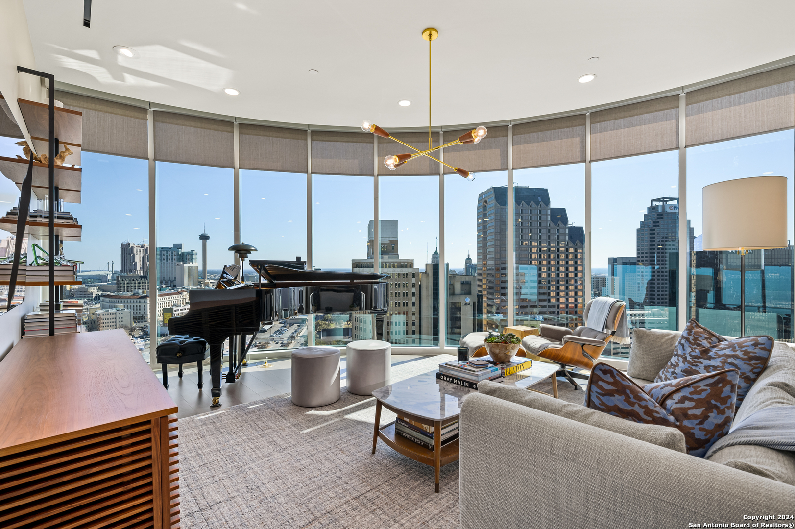 a living room with lots of furniture and a chandelier