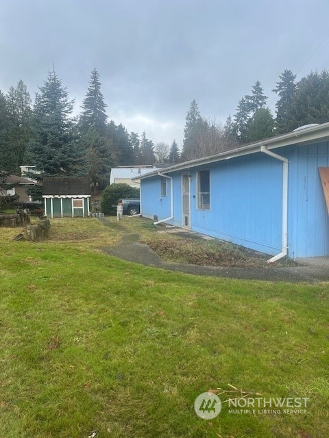 a house view with swimming pool in front of it