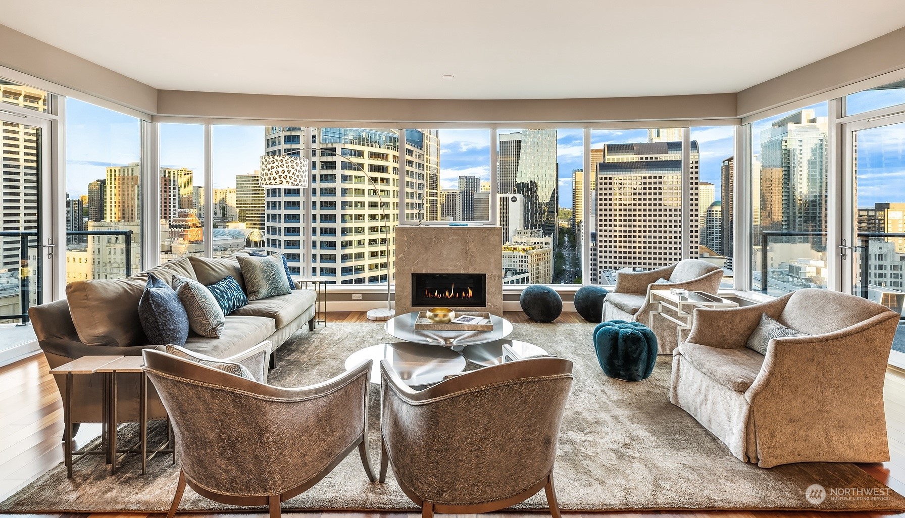 a living room with furniture and large windows