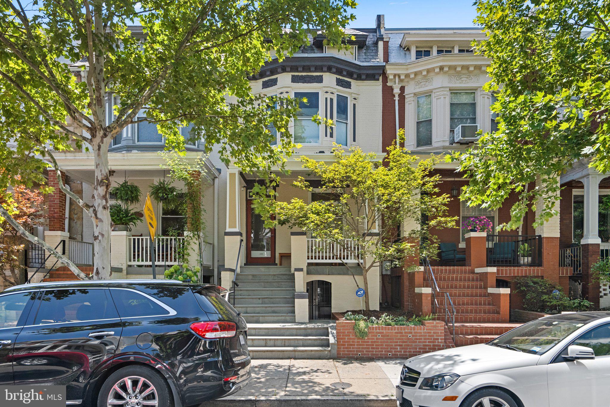 a front view of a residential apartment building with a yard