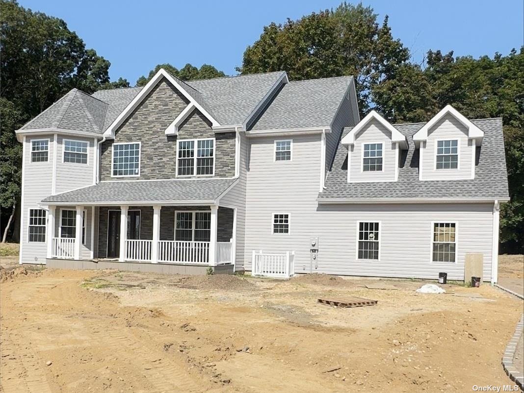 a view of a white house with a yard