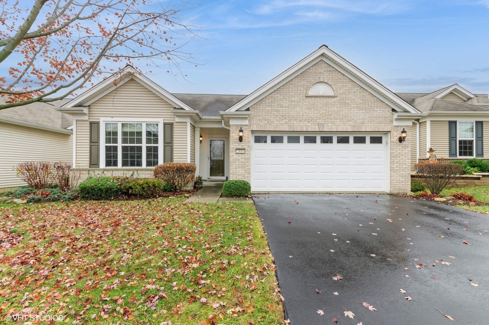 a view of a house with a yard and garage