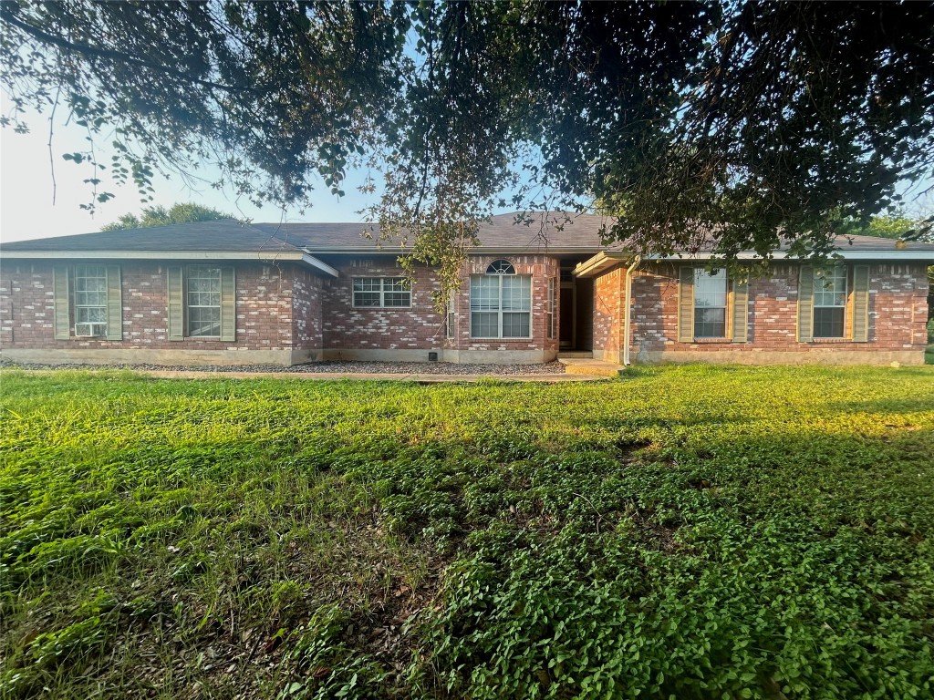 front view of a house with a yard