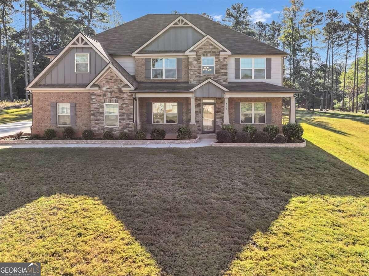 a front view of a house with a yard