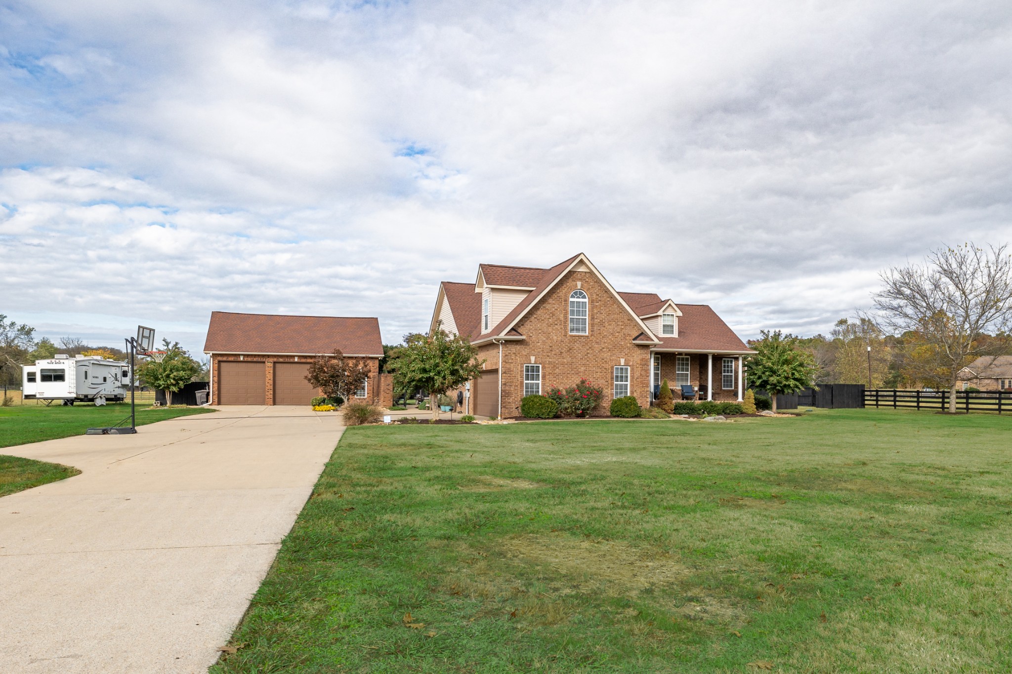 Brick Home on 3.27 acres.  Home has pasture on right side that allows for Livestock fully fenced.