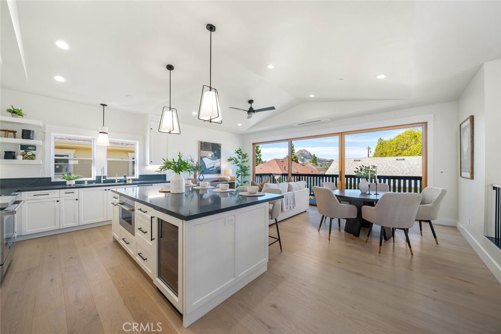 a kitchen with stainless steel appliances granite countertop stove top oven and cabinets