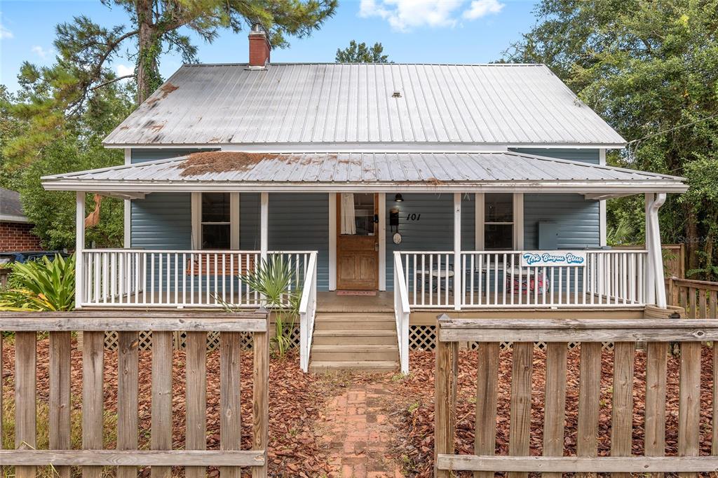 a front view of a house with a porch