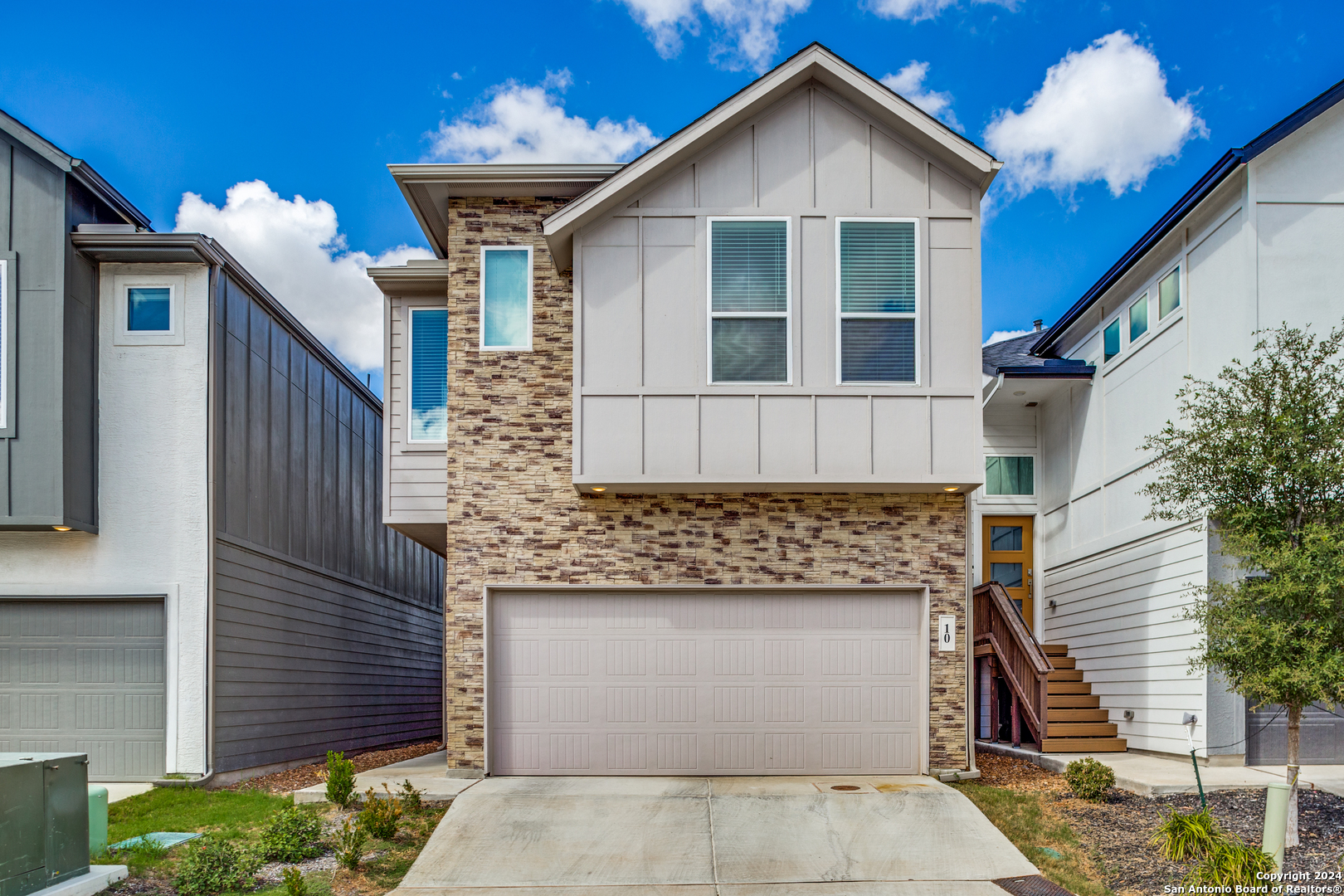 a front view of a house with a yard