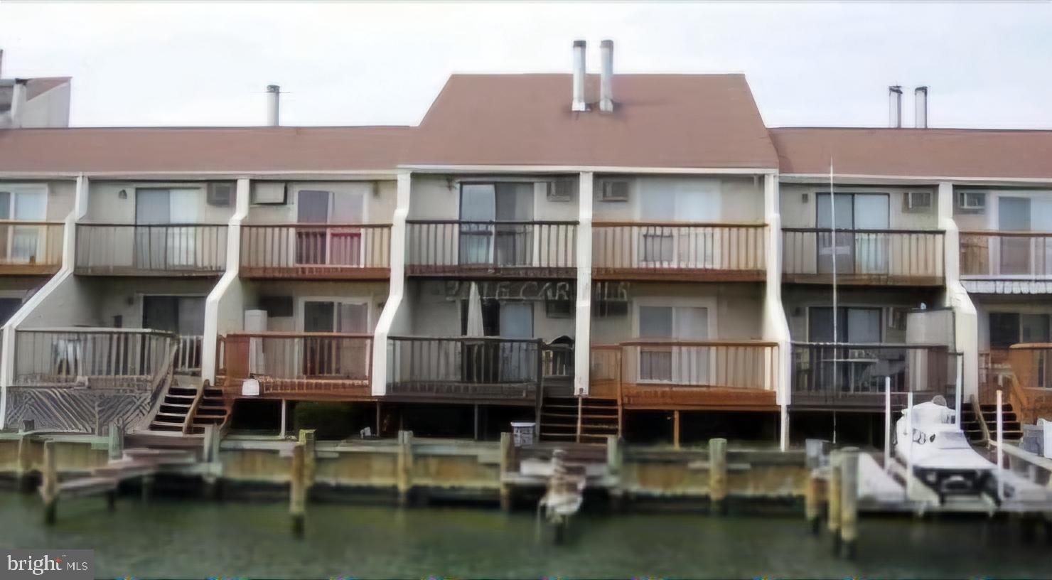 a front view of a building with lake view