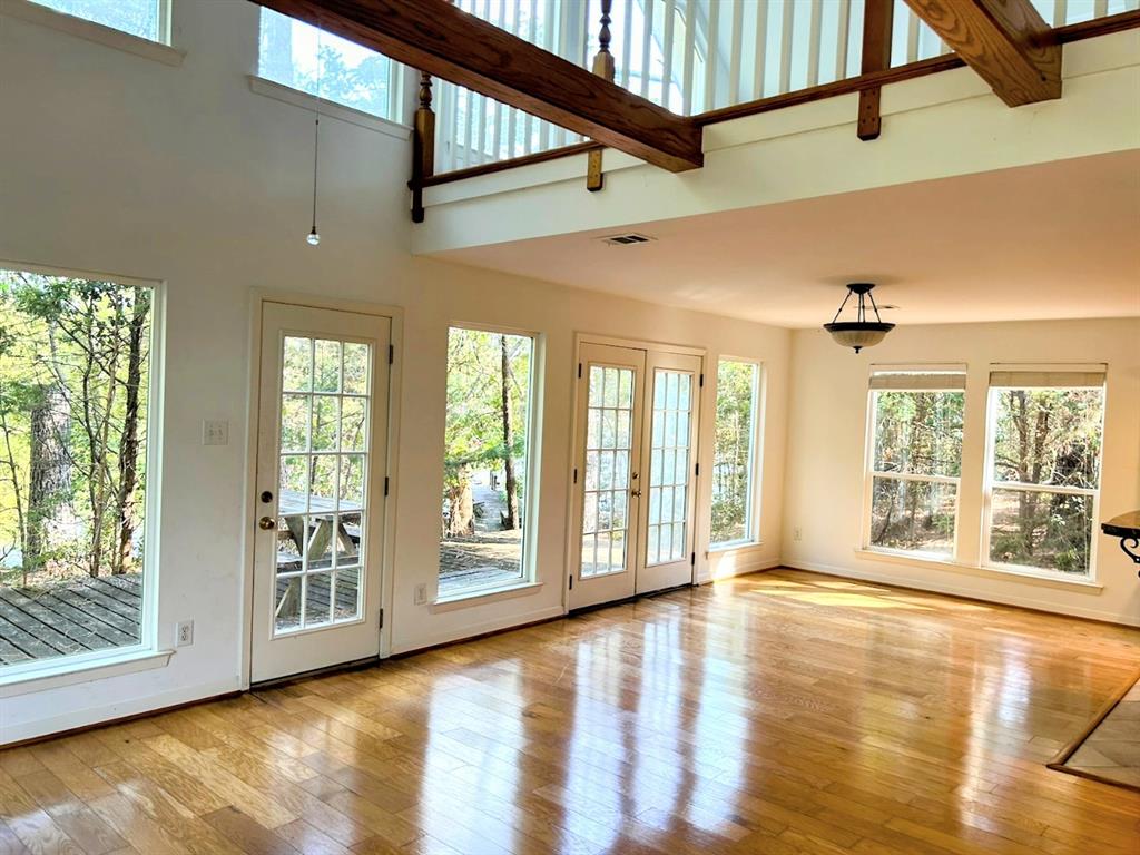 a view of an entryway with wooden floor and windows