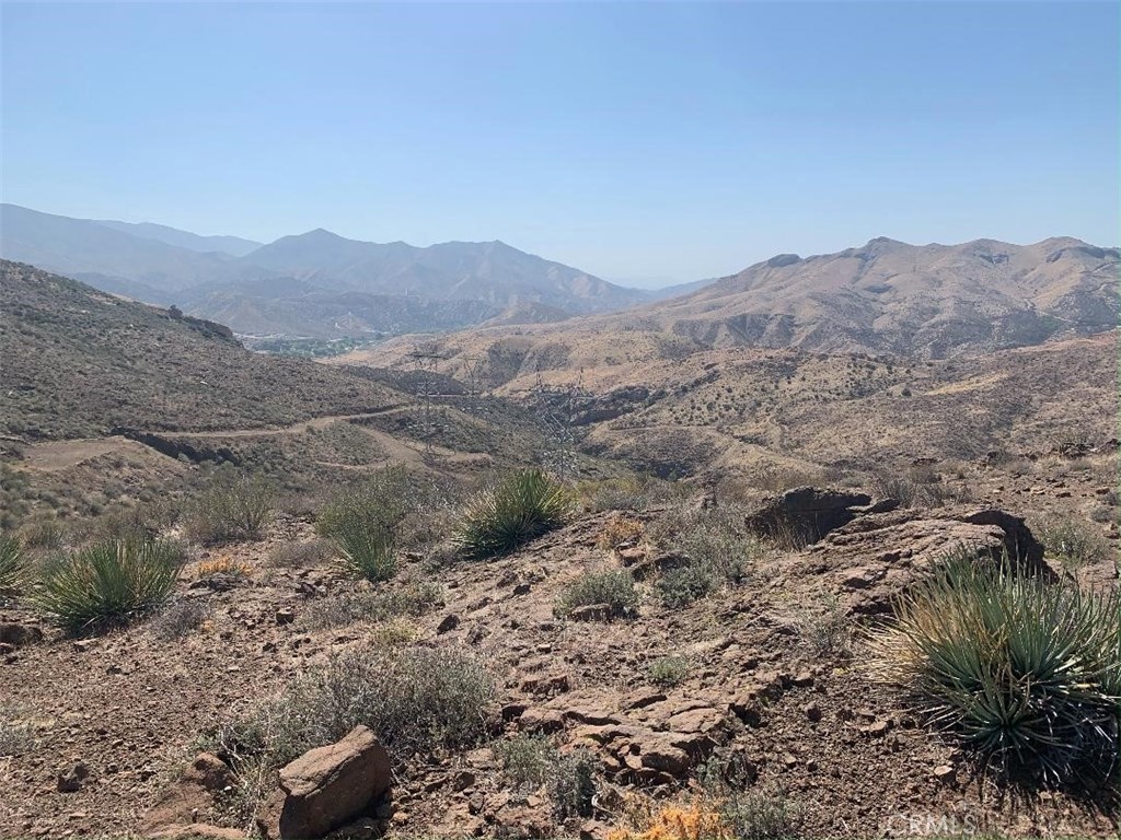 a view of a mountain range with trees