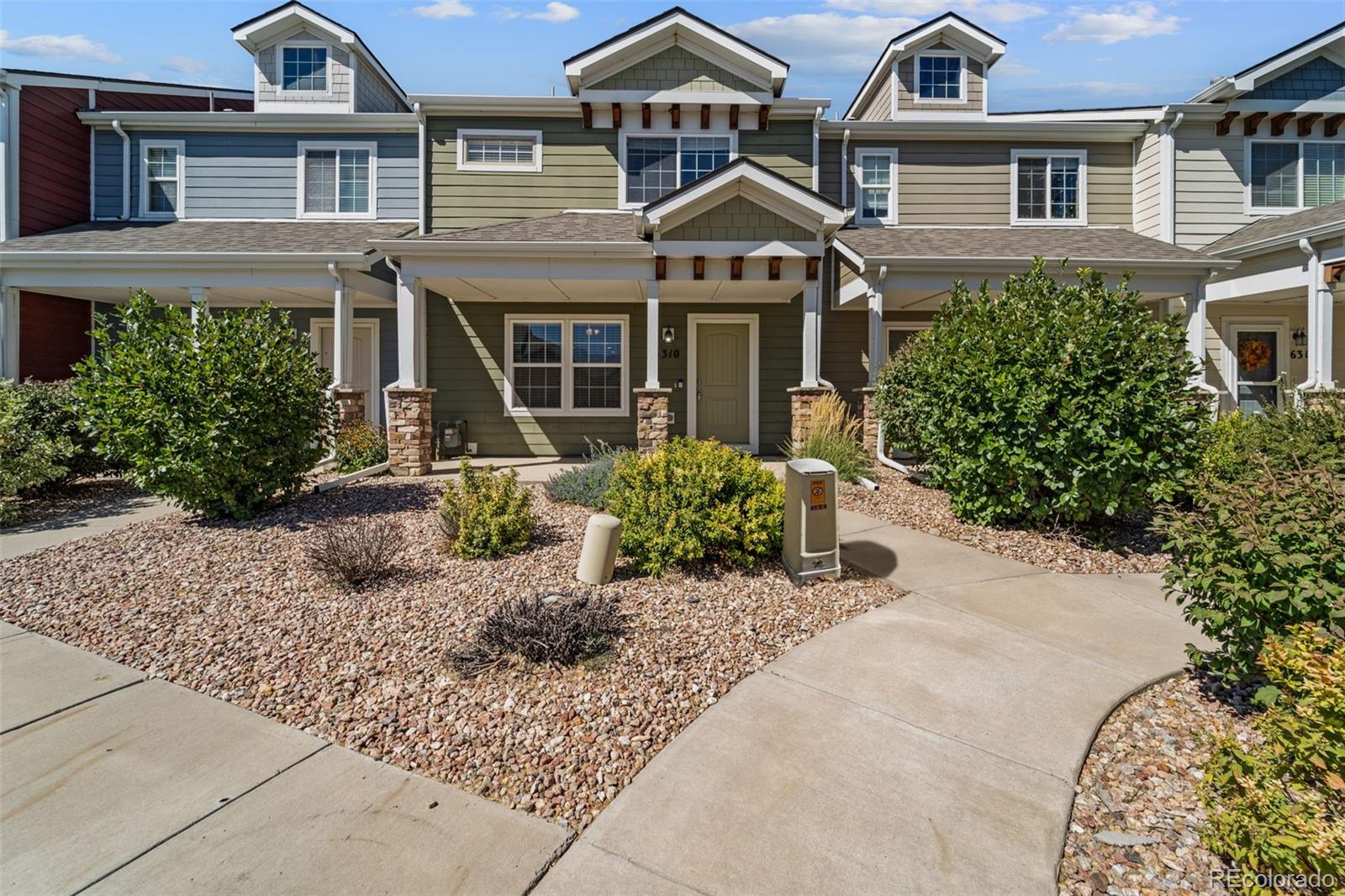 front view of a house with a small yard