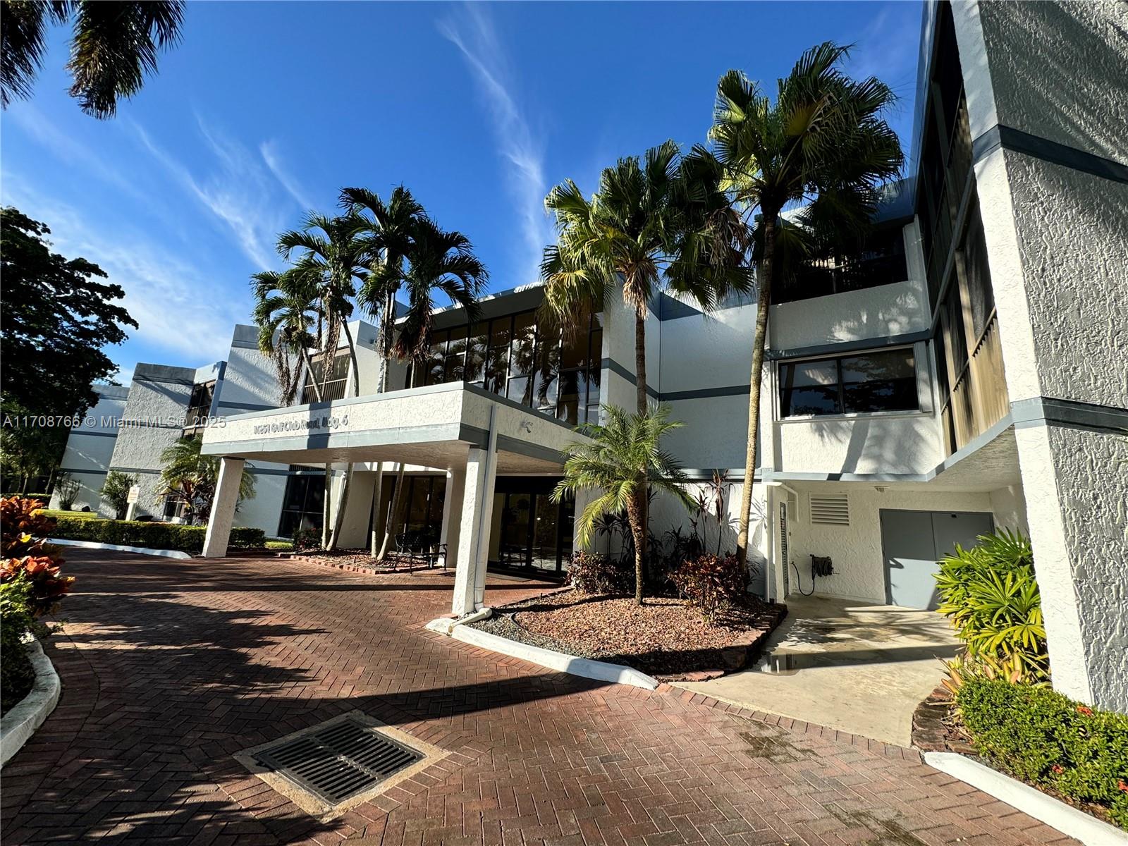 a front view of a building with street view