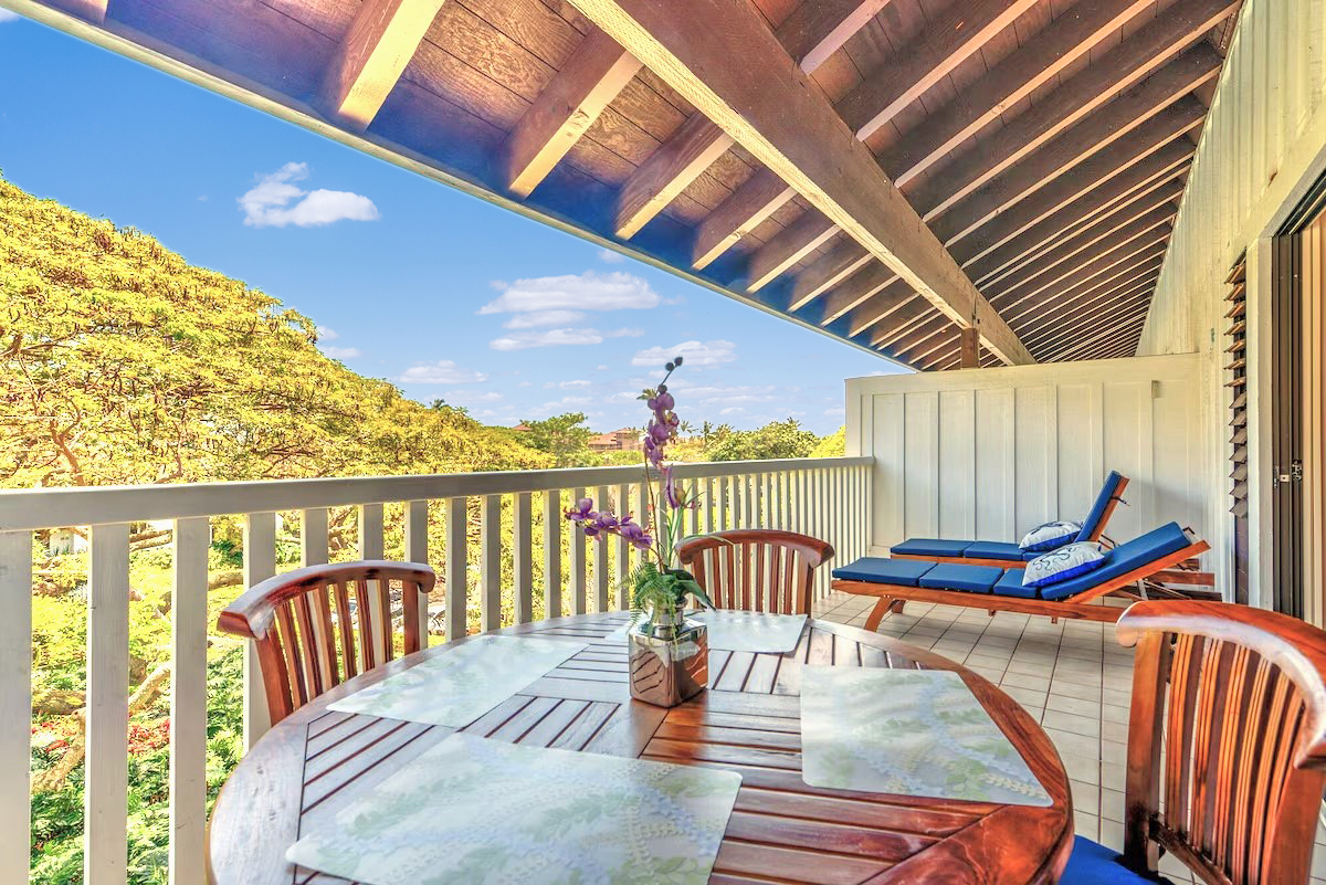 a view of a balcony with chairs