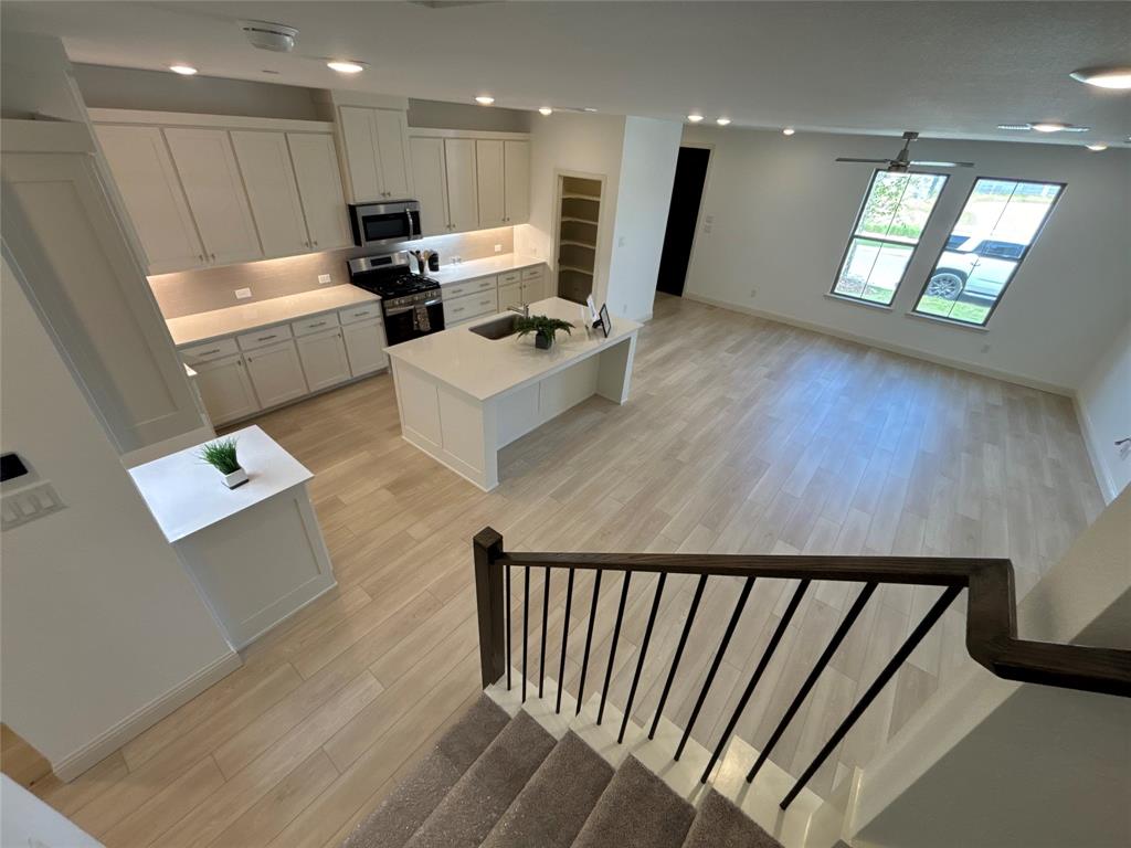 a view of kitchen with furniture and a window