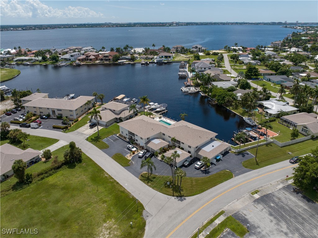 an aerial view of a house with a lake view