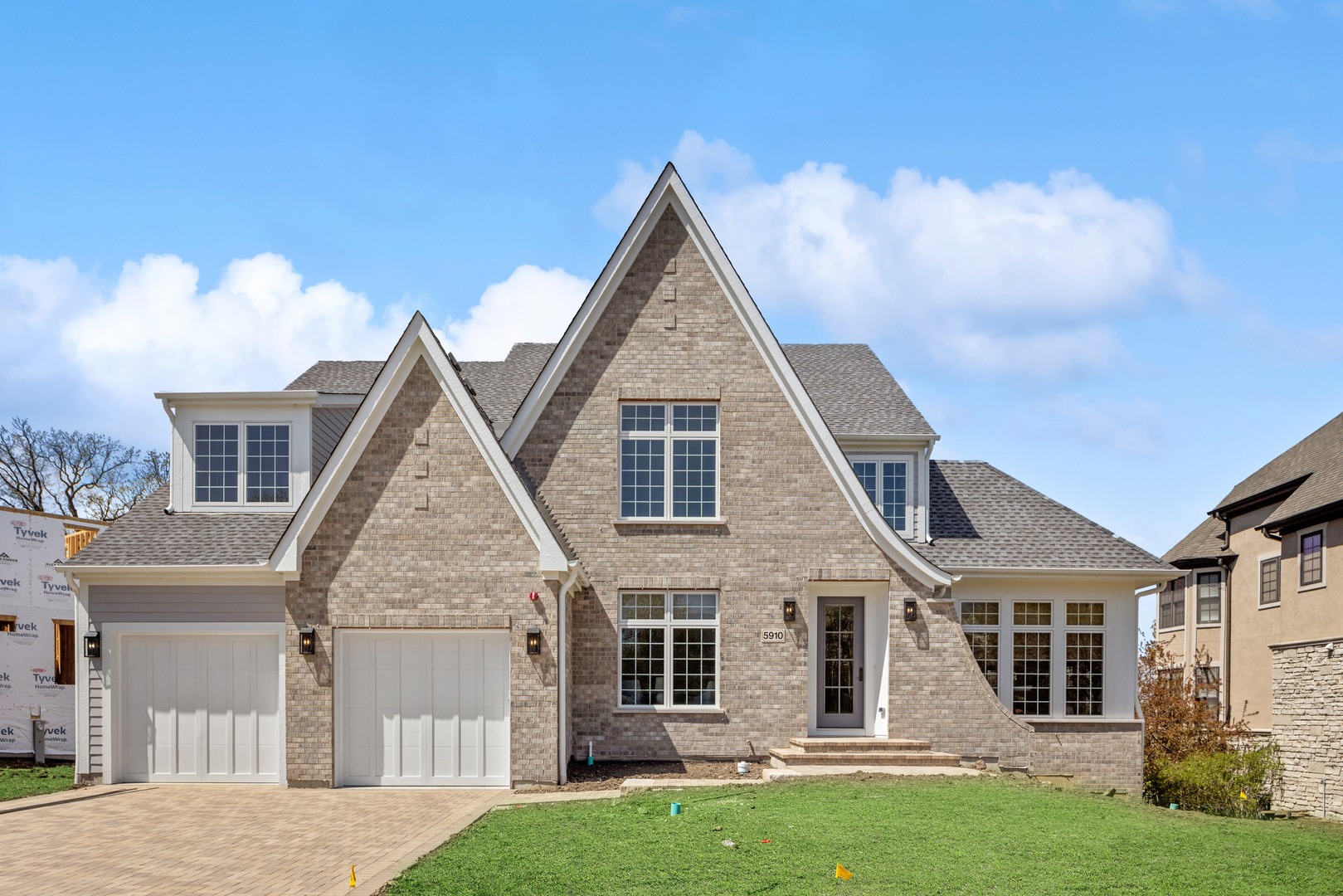 front view of a house with a yard