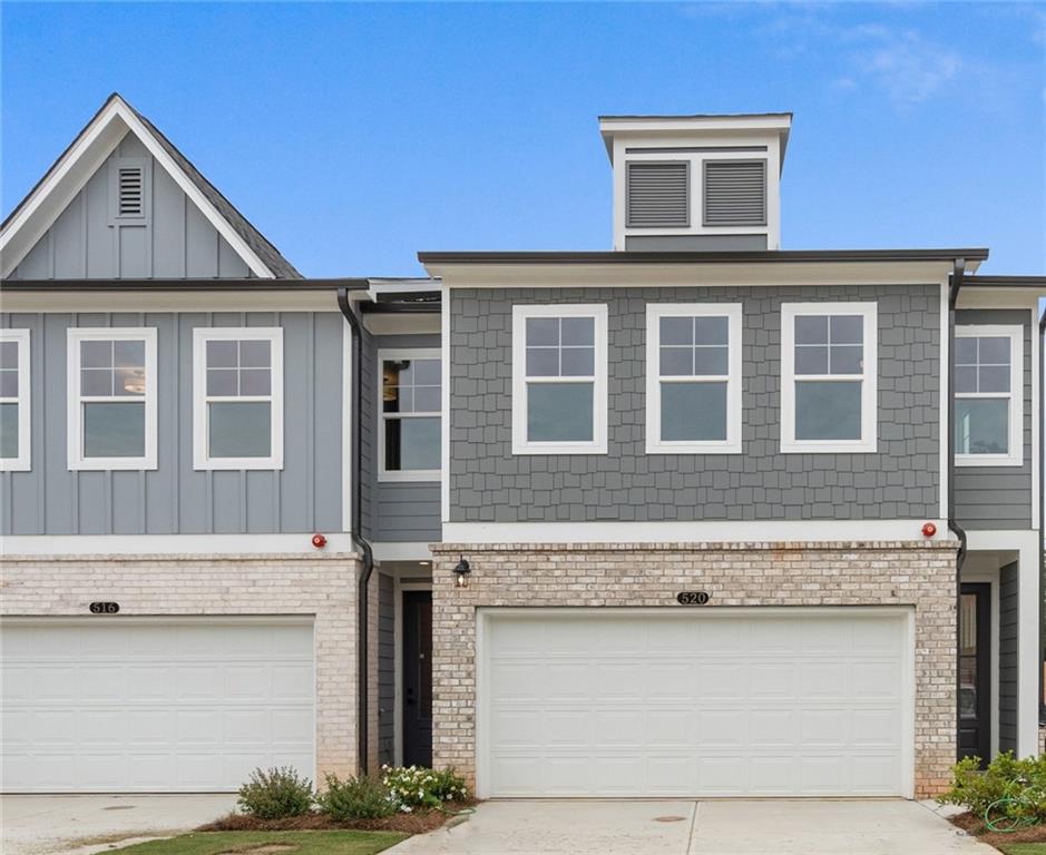 a front view of a house with garage