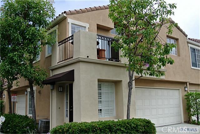 a house that has a tree in front of the house