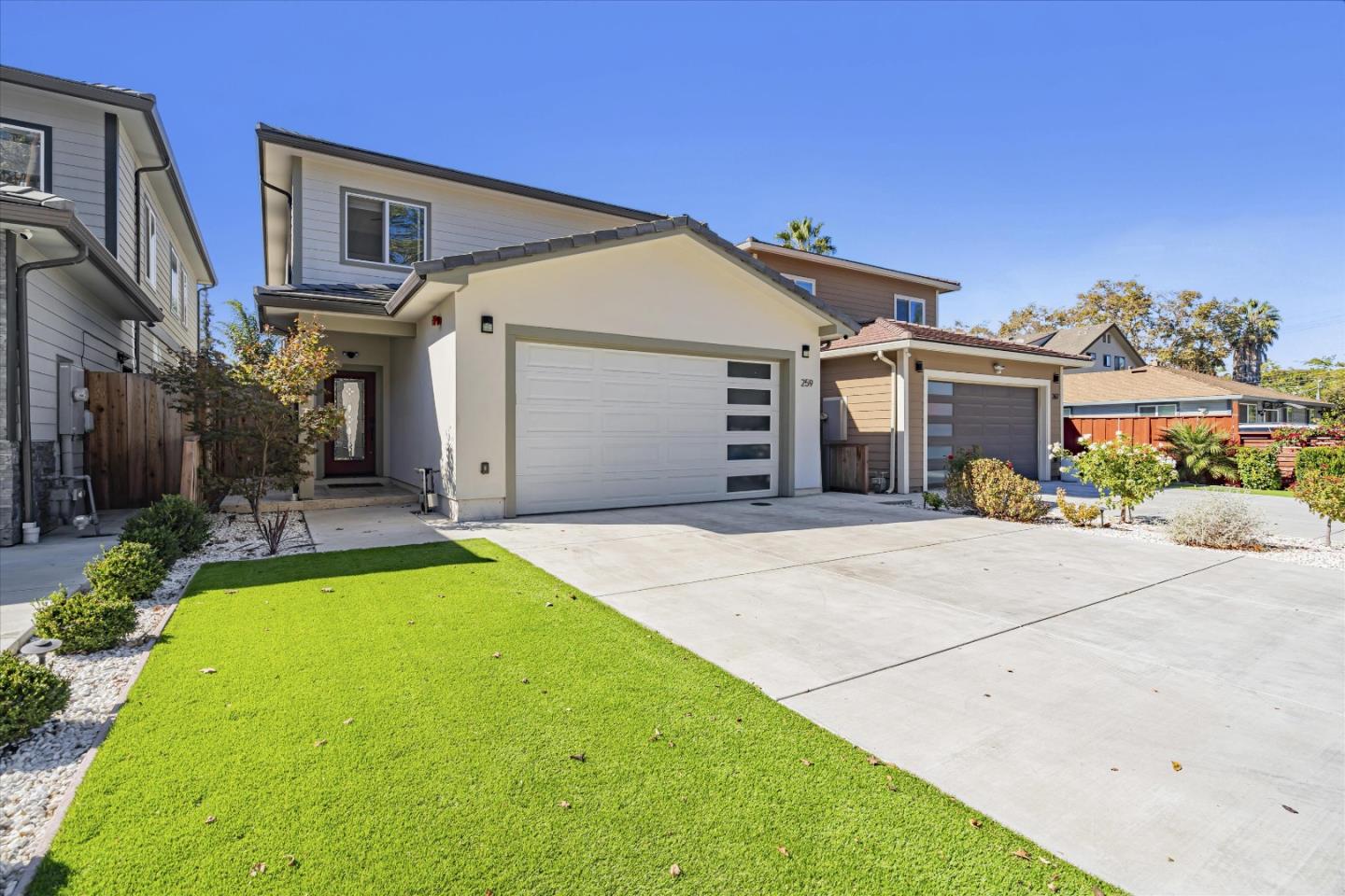 a front view of a house with yard