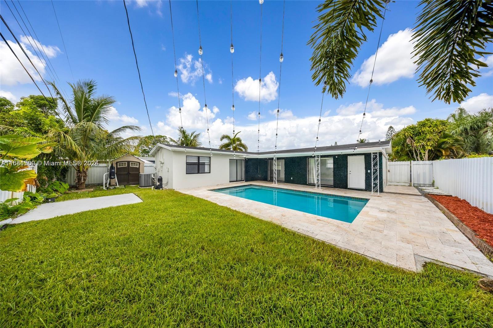 a view of a house with swimming pool