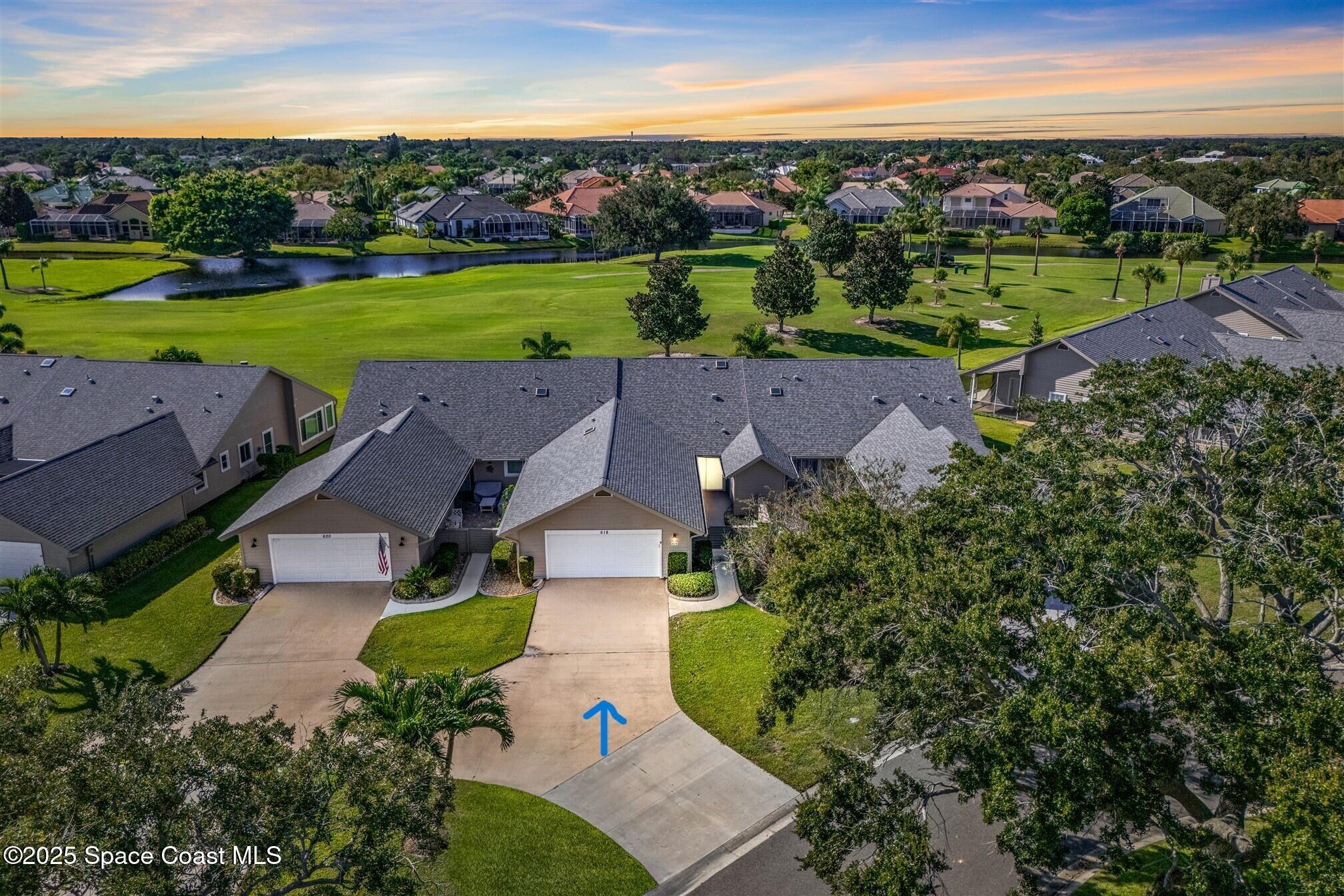 an aerial view of a house with big yard