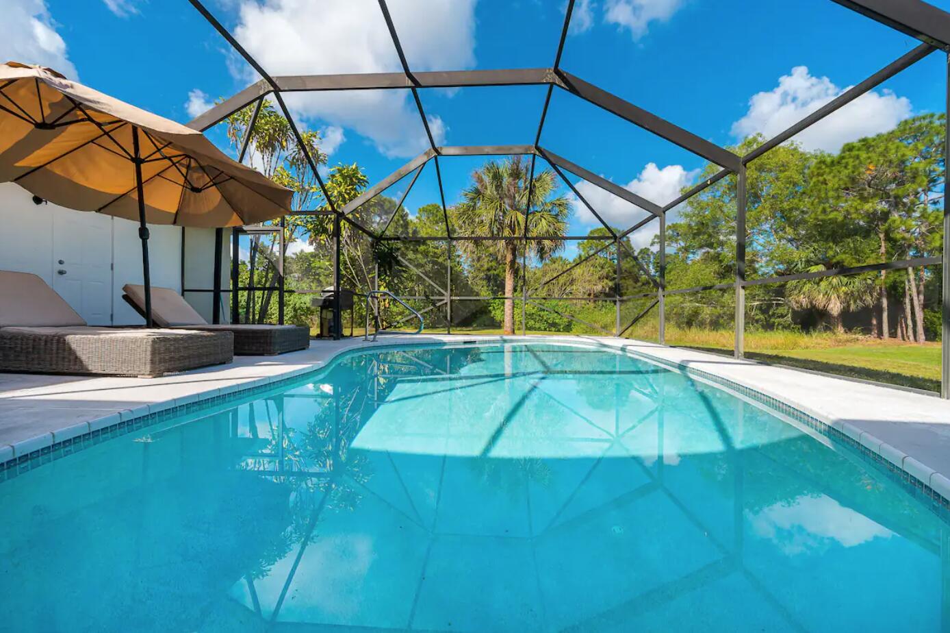 swimming pool with an outdoor seating and yard