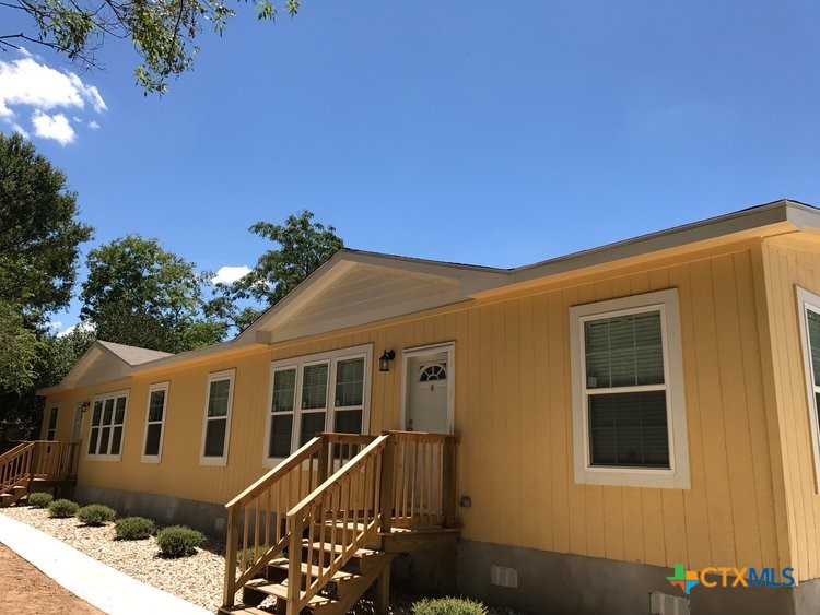 a front view of a house with yard