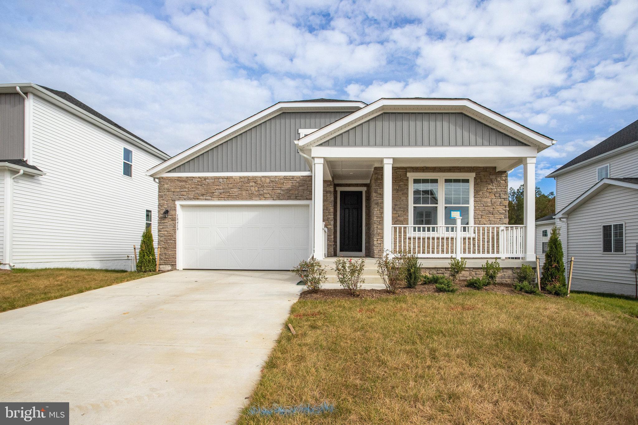 a front view of a house with yard