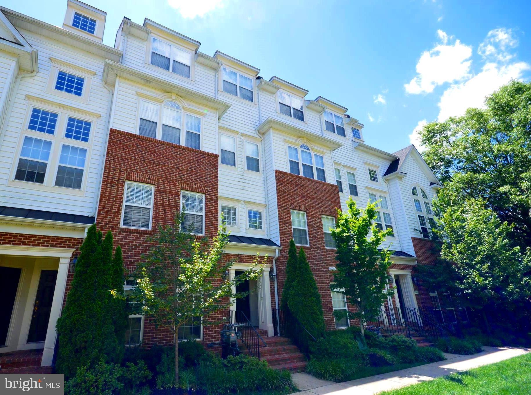 a front view of a multi story residential apartment buildings