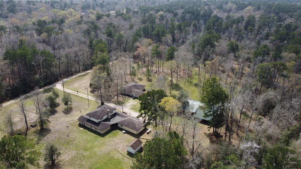 an aerial view of house with yard