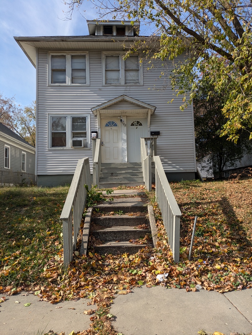 front view of a house with a yard