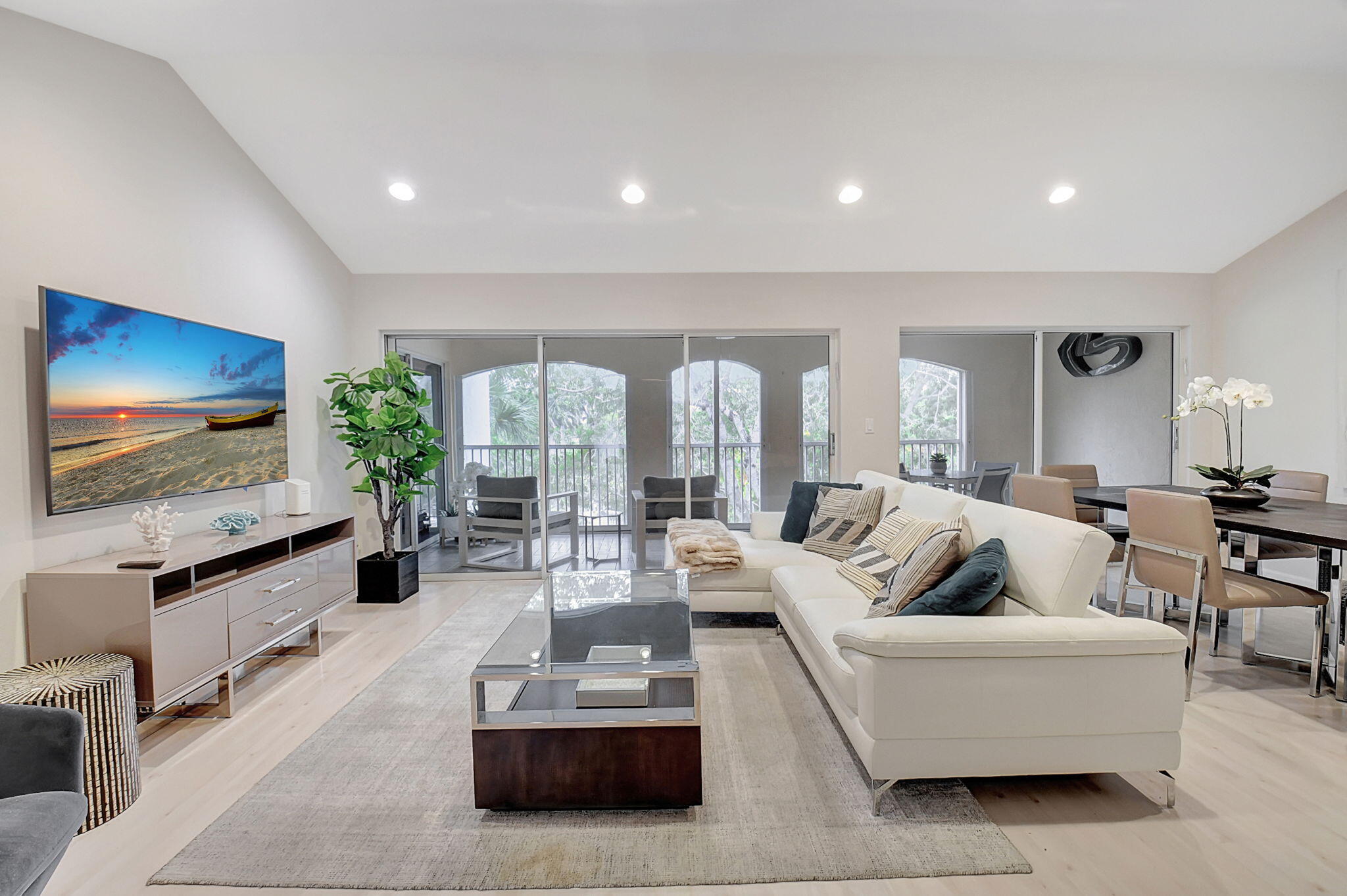 a living room with fireplace furniture and a flat screen tv