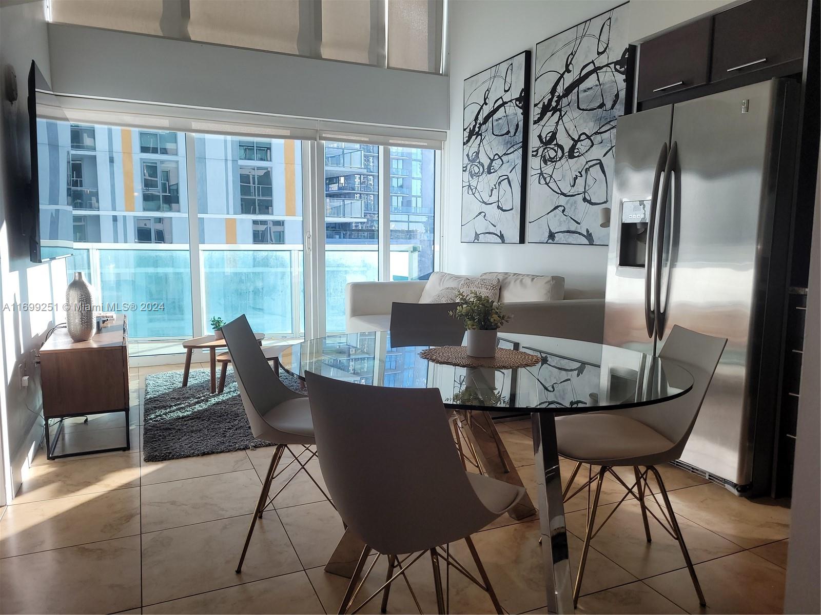 a view of a dining room with furniture